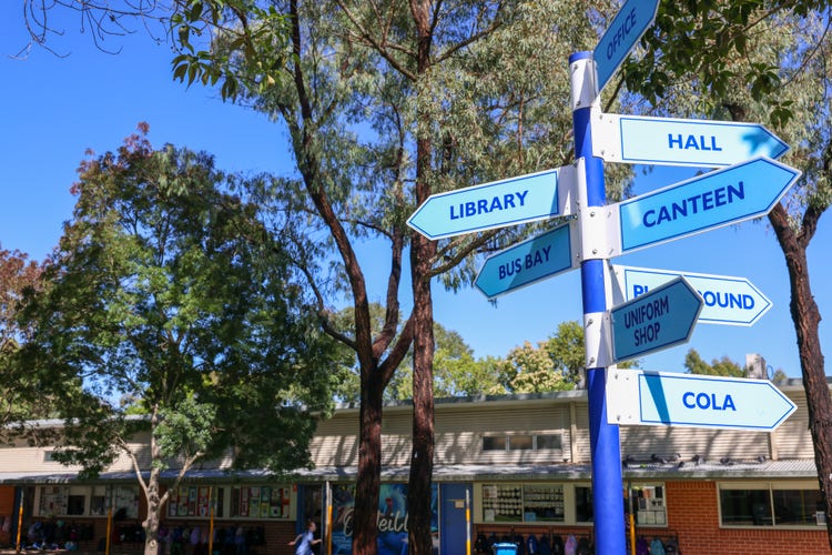 school grounds with loaction sign